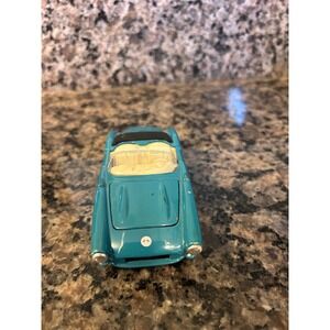 die-cast model of a 1957 Chevrolet Corvette convertible.